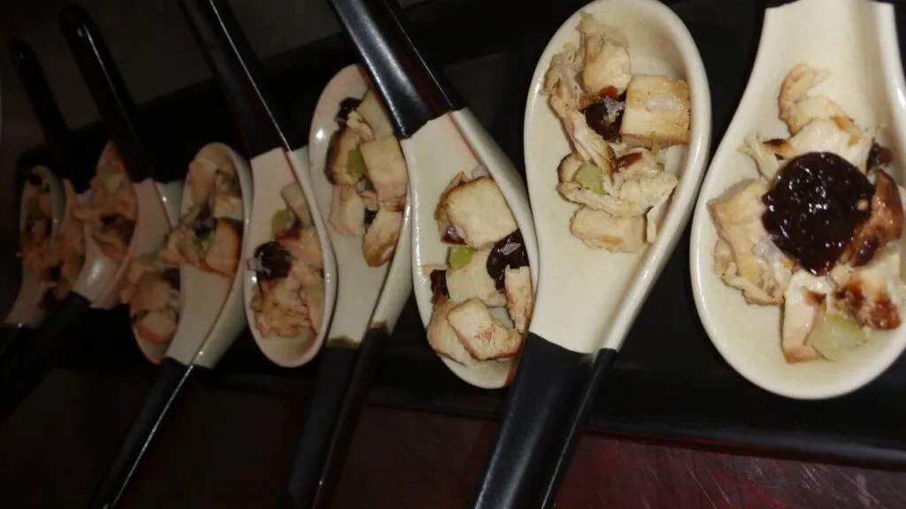 Smoked chicken with dried cherries and walnut oil on Asian spoons 1024x576 - Butlered Hors d'oeuvres